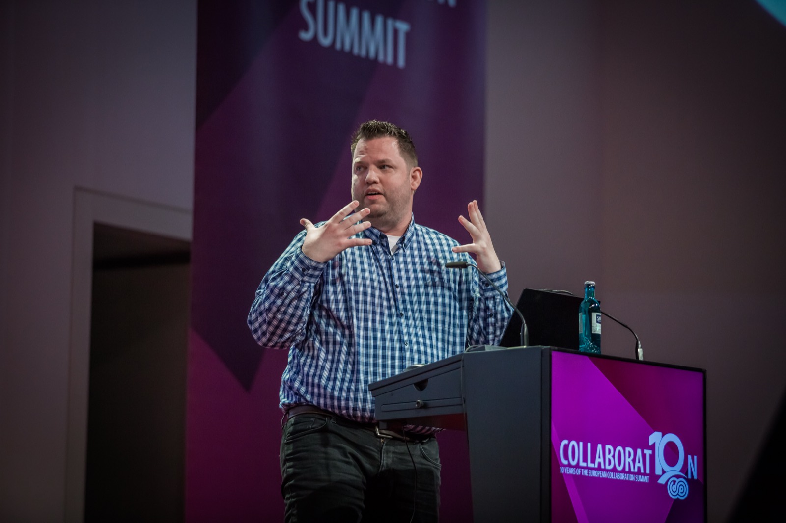 Daniel Laskewitz speaking from the main stage at the European Collaboration Summit 2023.